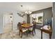 Charming dining area with a wooden table and chairs, offering a view of the living room at 649 S Arrowwood Way, Mesa, AZ 85208