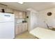 Kitchen boasts light wood cabinets and an island countertop at 649 S Arrowwood Way, Mesa, AZ 85208