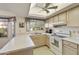 Efficient kitchen with light wood cabinets, a breakfast bar, and ample counter space at 649 S Arrowwood Way, Mesa, AZ 85208