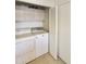 Laundry room with washer, dryer, and storage cabinets at 649 S Arrowwood Way, Mesa, AZ 85208