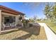 Relaxing patio with table and chairs, overlooking the green at 649 S Arrowwood Way, Mesa, AZ 85208