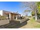 Private patio with seating area and lush landscaping at 649 S Arrowwood Way, Mesa, AZ 85208