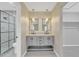 Modern bathroom boasts double vanity, large mirror, and a separate shower at 7607 N 42Nd Ln, Phoenix, AZ 85051