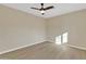 Bright bedroom with ceiling fan and light wood flooring at 7607 N 42Nd Ln, Phoenix, AZ 85051