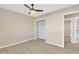Bedroom with ceiling fan, window, and spacious closet at 7607 N 42Nd Ln, Phoenix, AZ 85051