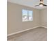 Well-lit bedroom with ceiling fan, window, and wood-look floors at 7607 N 42Nd Ln, Phoenix, AZ 85051