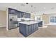 Modern kitchen with dark blue cabinetry, quartz countertops and stainless steel appliances at 7607 N 42Nd Ln, Phoenix, AZ 85051