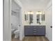 Bathroom showcasing a double sink vanity with a modern design and a separate toilet and shower area at 8366 S Grandview Ave, Tempe, AZ 85284