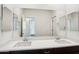 Modern bathroom with double vanity and large mirror at 8499 N 174Th Ave, Waddell, AZ 85355