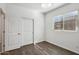 Bedroom with wood-look floors and sliding door at 8499 N 174Th Ave, Waddell, AZ 85355