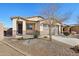 One-story house with a two-car garage and drought-tolerant landscaping at 8499 N 174Th Ave, Waddell, AZ 85355