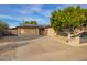 Single story home with solar panels, driveway and mature landscaping at 8644 E Roanoke Ave, Scottsdale, AZ 85257