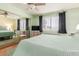 Comfortable bedroom features a large window and ceiling fan at 9270 W Morrow Dr, Peoria, AZ 85382