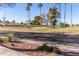 Landscaped community with tree-lined streets and golf course views at 9270 W Morrow Dr, Peoria, AZ 85382