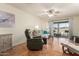 Bright living room featuring hardwood floors and patio access at 9270 W Morrow Dr, Peoria, AZ 85382