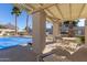Relaxing pool area with covered seating and tables at 9270 W Morrow Dr, Peoria, AZ 85382