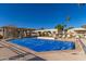 Community pool with a blue cover and surrounding lounge chairs at 9270 W Morrow Dr, Peoria, AZ 85382
