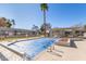 Community pool with blue cover and lounge chairs at 9270 W Morrow Dr, Peoria, AZ 85382