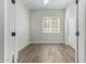 Well-lit bedroom with wood-look tile flooring at 10329 E Nopal Ave, Mesa, AZ 85209