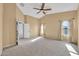 Bright and spacious bedroom with carpet and neutral tones at 10335 E Aster Ln, Florence, AZ 85132