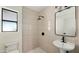 Stylish bathroom showcasing sleek fixtures, a stand-up shower, and contemporary tiling at 1036 E Glenn Dr, Phoenix, AZ 85020