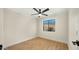Cozy bedroom features neutral walls, wood floors, ceiling fan and one window at 1036 E Glenn Dr, Phoenix, AZ 85020