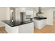 Modern kitchen features stainless appliances, granite countertops, and ample cabinet space at 1036 E Glenn Dr, Phoenix, AZ 85020