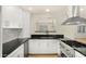 Well-appointed kitchen with stainless appliances, granite countertops, and crisp white cabinetry at 1036 E Glenn Dr, Phoenix, AZ 85020