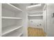 Walk-in pantry providing ample storage space with built-in shelving at 1036 E Glenn Dr, Phoenix, AZ 85020