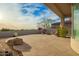 Flagstone patio with fire pit and mountain views at 11003 E Turnberry Rd, Scottsdale, AZ 85255