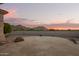 Flagstone patio with mountain views at sunset at 11003 E Turnberry Rd, Scottsdale, AZ 85255