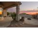 Spacious flagstone patio with fire pit and mountain views at 11003 E Turnberry Rd, Scottsdale, AZ 85255