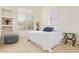 Serene bedroom featuring a plush bed and built-in shelving at 11003 E Turnberry Rd, Scottsdale, AZ 85255