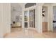 Bright entryway with a glass front door and light tile floors at 11003 E Turnberry Rd, Scottsdale, AZ 85255