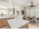 Eat-in kitchen with light wood cabinets, breakfast nook, and view into the living room at 11003 E Turnberry Rd, Scottsdale, AZ 85255