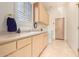 Well-lit laundry room with washer, dryer and cabinets at 11003 E Turnberry Rd, Scottsdale, AZ 85255