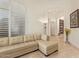 Spacious living room with a sectional sofa and access to hallway at 11003 E Turnberry Rd, Scottsdale, AZ 85255