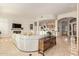 Living room features a large sectional sofa and a fireplace at 11003 E Turnberry Rd, Scottsdale, AZ 85255
