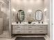 Spa-like bathroom with double vanity, modern lighting, and large mirrors at 11509 E Beck Ln, Scottsdale, AZ 85255