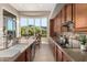 Kitchen with island, breakfast nook, and stunning mountain views at 11509 E Beck Ln, Scottsdale, AZ 85255