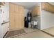 Garage with storage cabinets and water heater at 11516 E Buckskin Trl, Scottsdale, AZ 85255