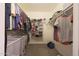 Organized walk-in closet featuring shelving, hanging rods, and ample space for clothes and accessories at 13530 W Spanish Garden Dr, Sun City West, AZ 85375