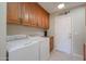 Laundry room with washer, dryer, and cabinets at 13816 N 109Th Ave, Sun City, AZ 85351