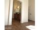 Elegant bathroom with double sinks and wood cabinets at 14371 W Morning Star Trl, Surprise, AZ 85374