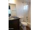Bathroom with dark vanity, granite countertop and bathtub at 14371 W Morning Star Trl, Surprise, AZ 85374