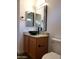 Bathroom with a vessel sink, granite countertop and modern fixtures at 14371 W Morning Star Trl, Surprise, AZ 85374