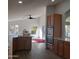 Open kitchen features stainless steel appliances and island at 14371 W Morning Star Trl, Surprise, AZ 85374