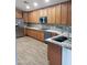 Modern kitchen with ample cabinetry, granite countertops, and stainless steel appliances at 14371 W Morning Star Trl, Surprise, AZ 85374