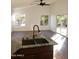 Bright living room featuring hardwood floors and sliding glass doors to backyard at 14371 W Morning Star Trl, Surprise, AZ 85374
