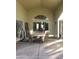 Covered patio with seating area and large window at 14371 W Morning Star Trl, Surprise, AZ 85374